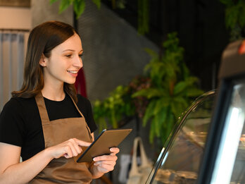 Smiling,Caucasian,Female,Small,Business,Owner,Standing,Near,Showcase,With