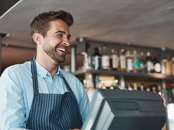 Smile,,Business,And,Man,As,Waiter,In,Cafe,For,Customer